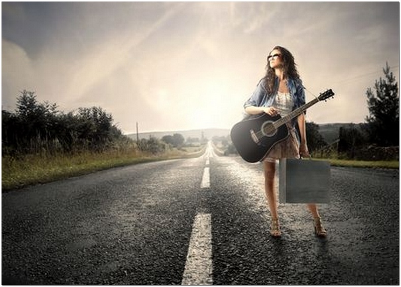 lady on road with guitar-larger